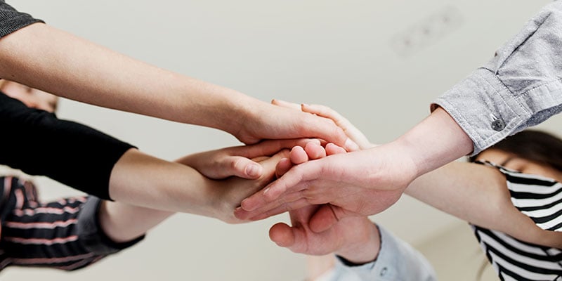 group-of-people-doing-handshake-and-cross-hands